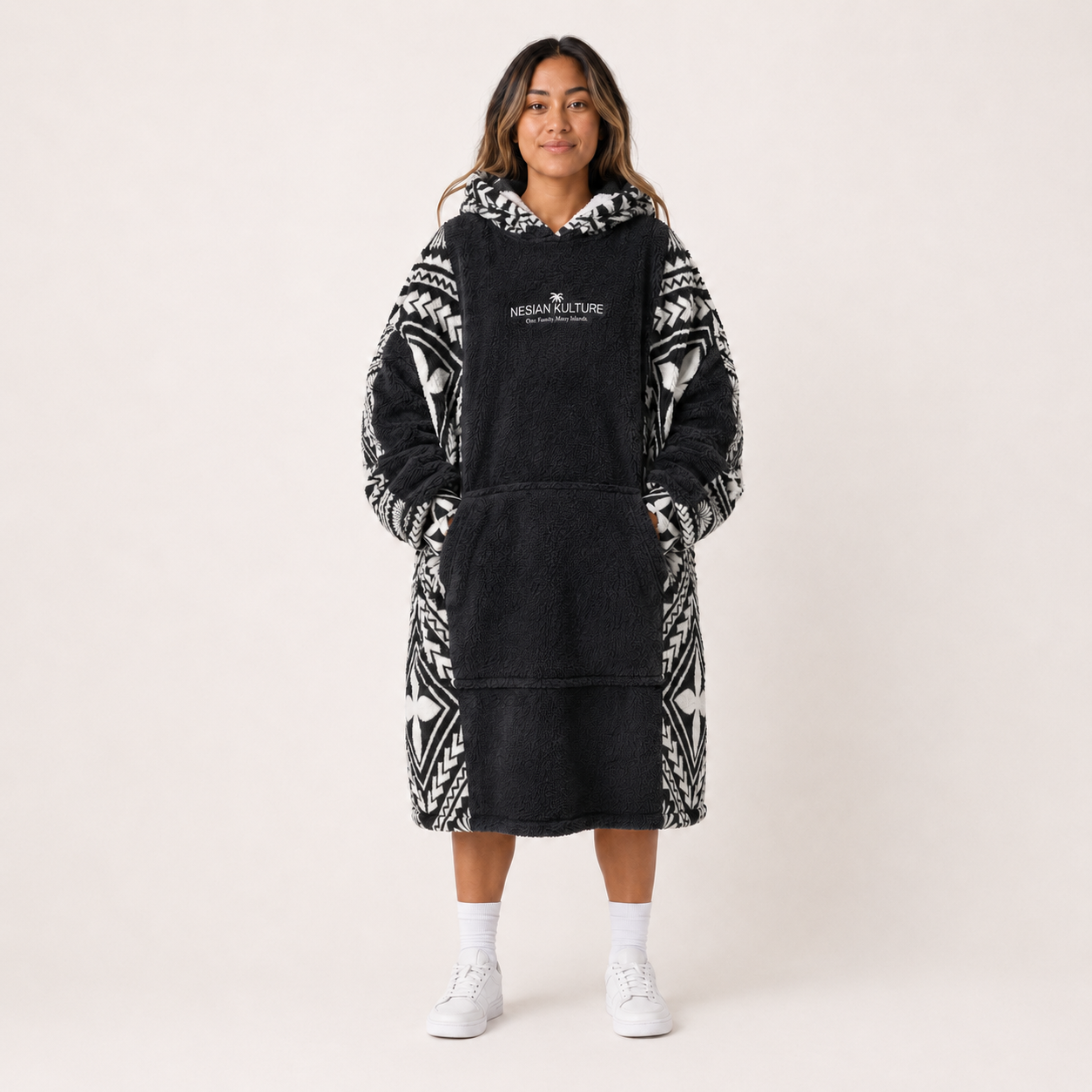 Nesian Kulture charcoal and white oversized snug hoodie, front view on female model