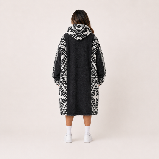 Nesian Kulture charcoal and white oversized snug hoodie, back view showing full garment design