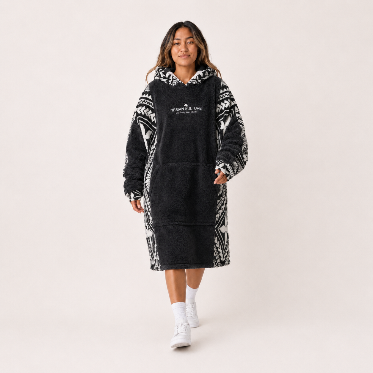 Nesian Kulture charcoal and white oversized snug hoodie, front walking view in studio