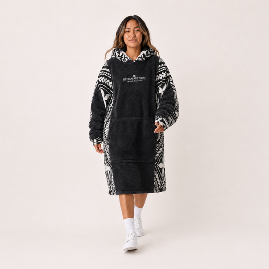 Nesian Kulture charcoal and white oversized snug hoodie, front walking view in studio